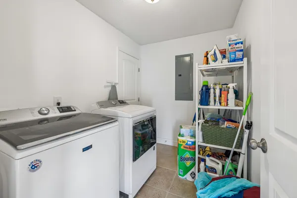 a utility room with dryer and washer