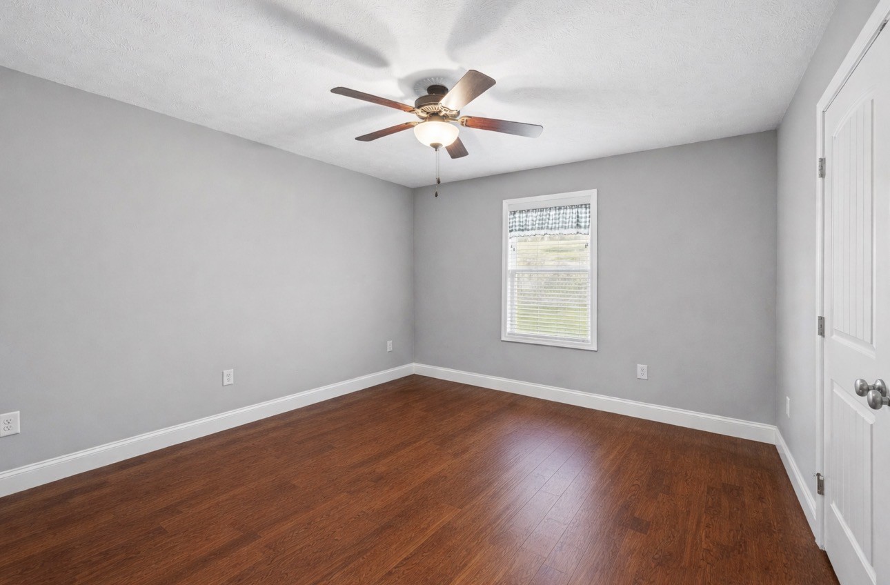 2 Hickman Creek Road North Hickman, TN 38567 - Photo 26 of 31 an empty room with wooden floor fan and windows