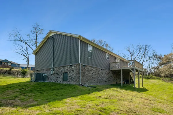 a view of a back yard of the house
