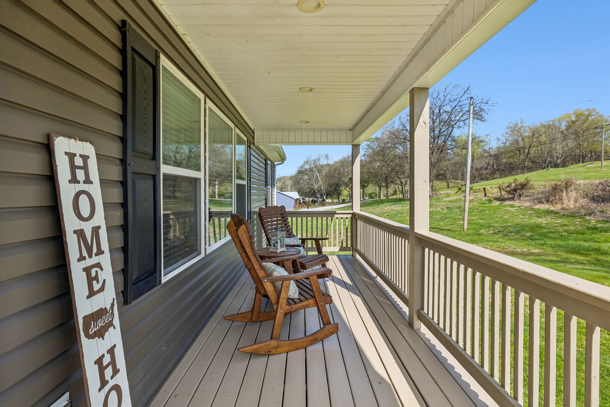 2 Hickman Creek Road North Hickman, TN 38567 - Photo 4 of 31 a view of a balcony with chairs and wooden floor