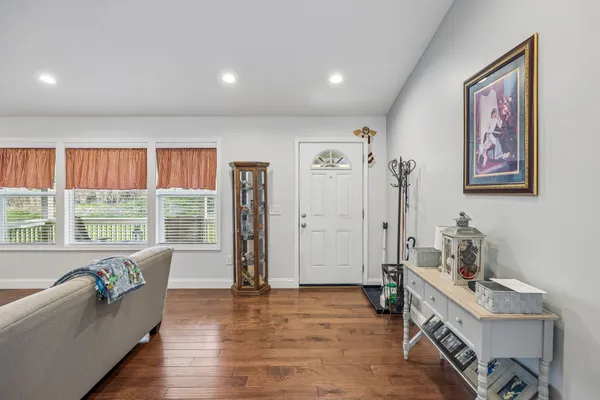 a spacious bedroom with a large bed and a window