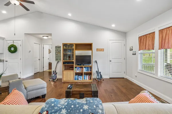 a living room with furniture and a flat screen tv