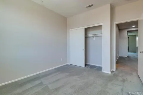 an empty room that has a bathroom