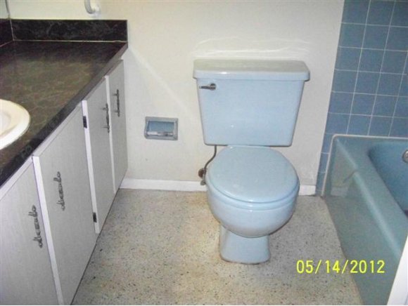 2959 Northeast Gemini Palm Bay, FL 32905 - Photo 8 of 12 a bathroom with a toilet and a sink