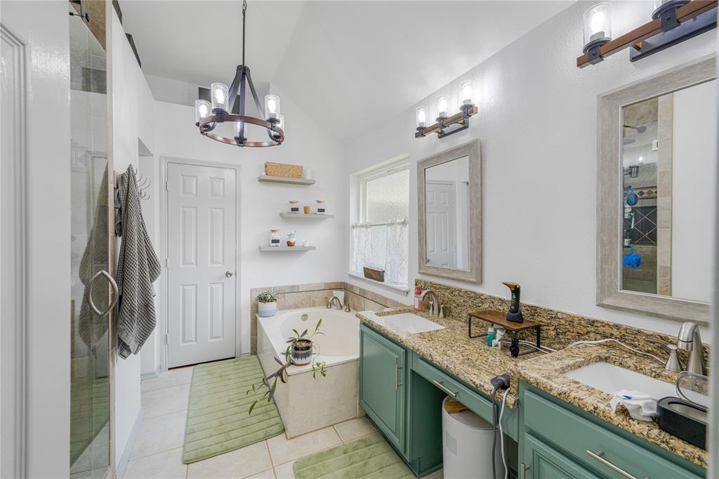 2813 Ridgemere Drive Flower Mound, TX 75028 - Photo 15 of 18 a spacious bathroom with a granite countertop sink a toilet a mirror and shower