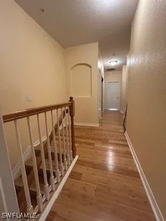 a view of gallery with wooden floor