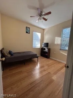 a view of a livingroom with furniture and a window