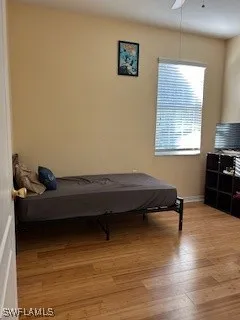 a room with wooden floor and furniture