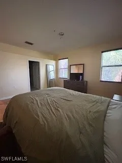 a view of a hallway view with wooden floor and staircase