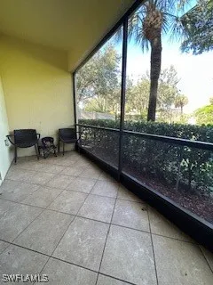 a view of a glass door and the balcony