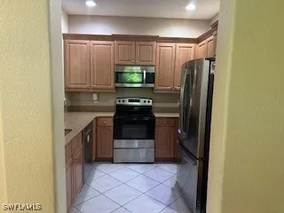 a kitchen with a refrigerator sink and stove
