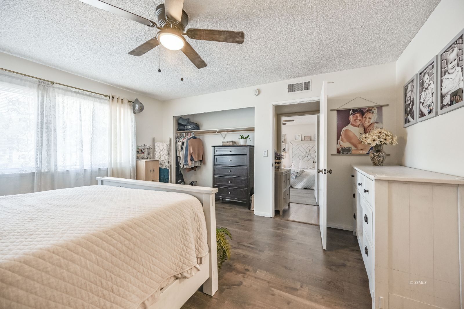 719 Sherri Street Ridgecrest, CA 93555 - Photo 27 of 36 a spacious bedroom with a bed and a walk in closet