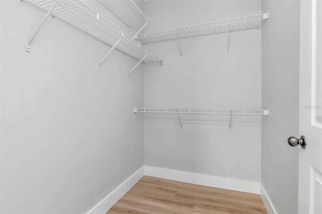 9916 Courtney Palms Boulevard, Unit 103 Tampa, FL 33619 - Photo 21 of 28 a view of a room with racks on the wall