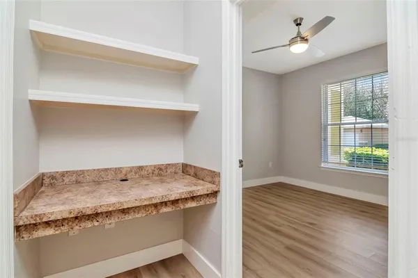 a bathroom with a granite countertop sink and a window