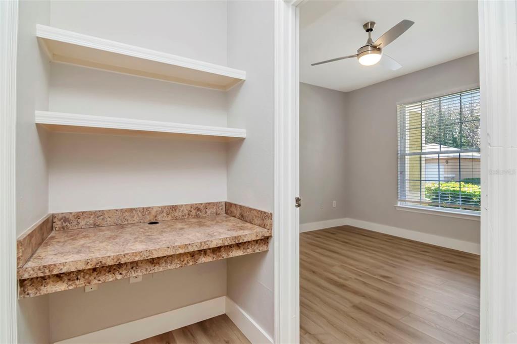 9916 Courtney Palms Boulevard, Unit 103 Tampa, FL 33619 - Photo 22 of 28 a bathroom with a granite countertop sink and a window