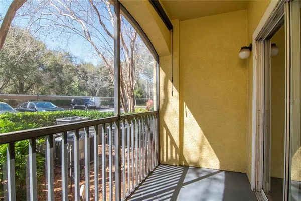 a view of a balcony with wooden floor