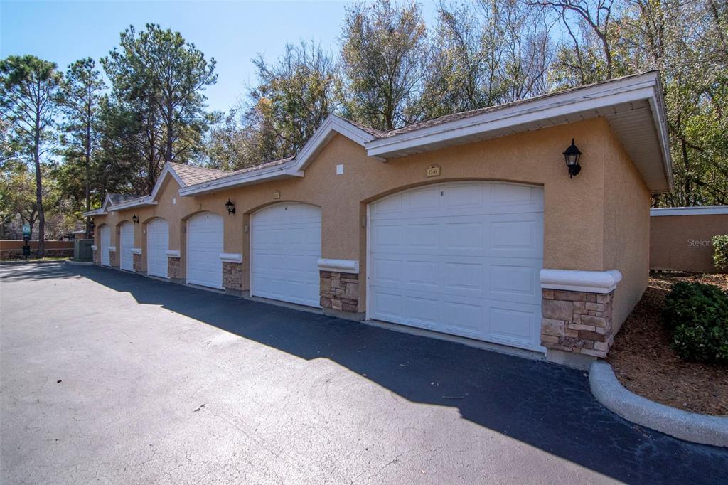 9916 Courtney Palms Boulevard, Unit 103 Tampa, FL 33619 - Photo 25 of 28 a front view of a house with a yard