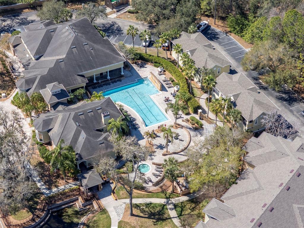 9916 Courtney Palms Boulevard, Unit 103 Tampa, FL 33619 - Photo 27 of 28 an aerial view of a house with a yard