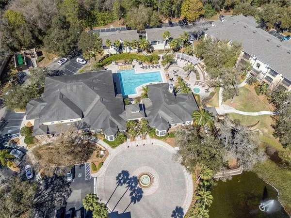 an aerial view of a house with a swimming pool