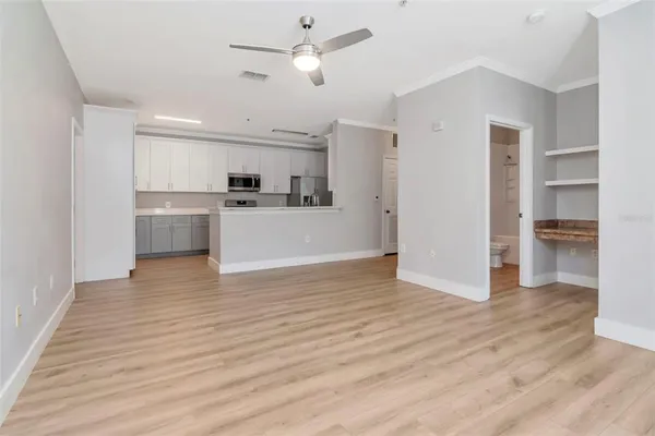 a view of kitchen and wooden floor
