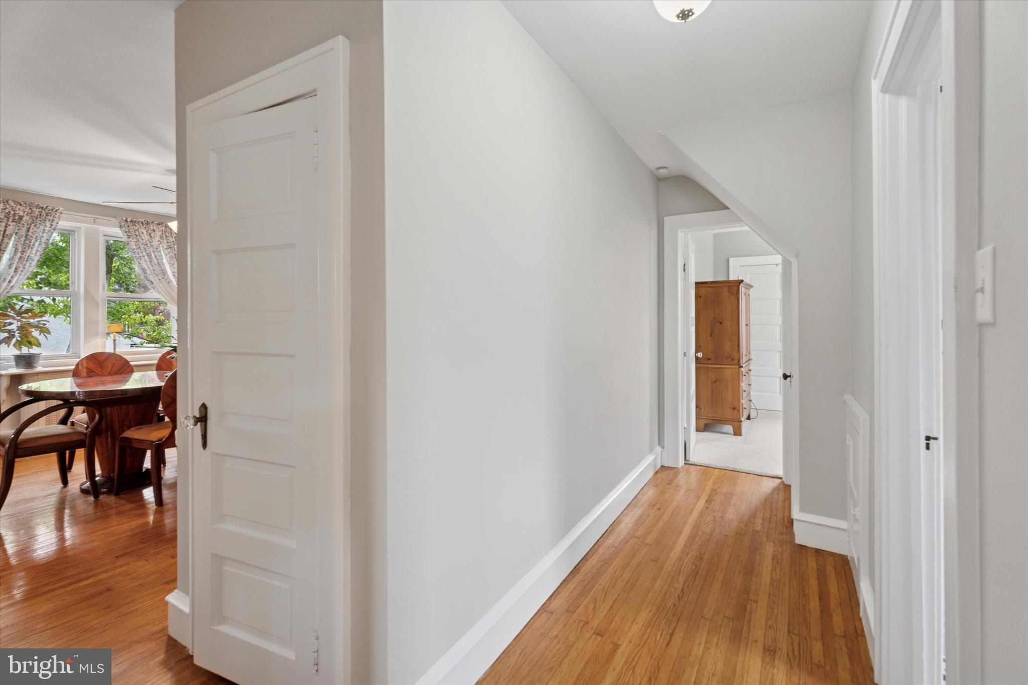 1442 Dorchester Road Havertown, PA 19083 - Photo 15 of 45 a view of a hallway with wooden floor and a dining room