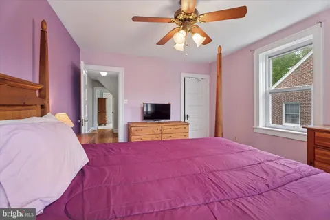 a bed room with a bed and a flat screen tv