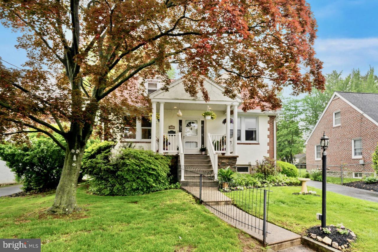 1442 Dorchester Road Havertown, PA 19083 - Photo 2 of 45 a front view of a house with a garden