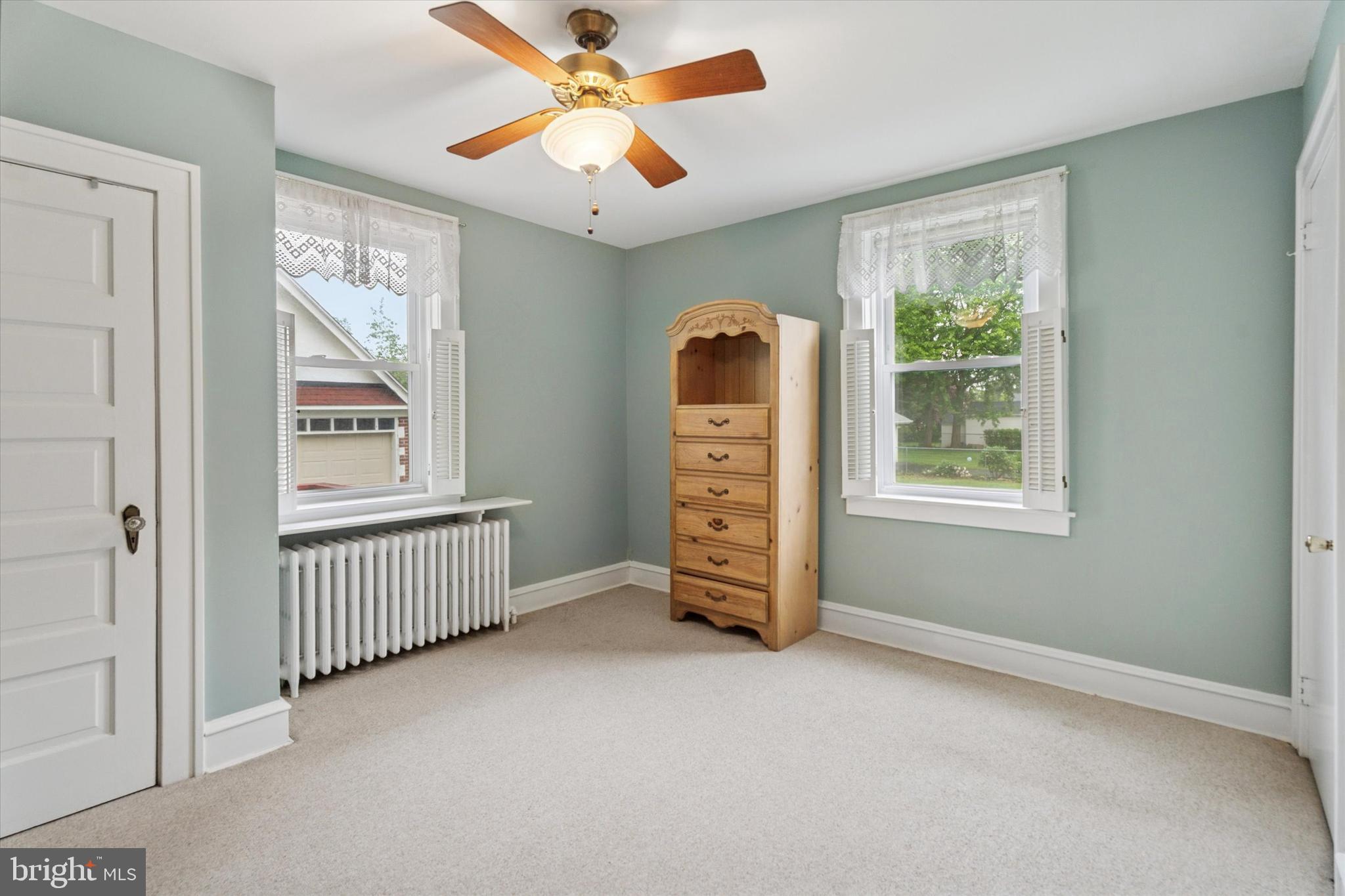 1442 Dorchester Road Havertown, PA 19083 - Photo 21 of 45 an empty room with windows and fan