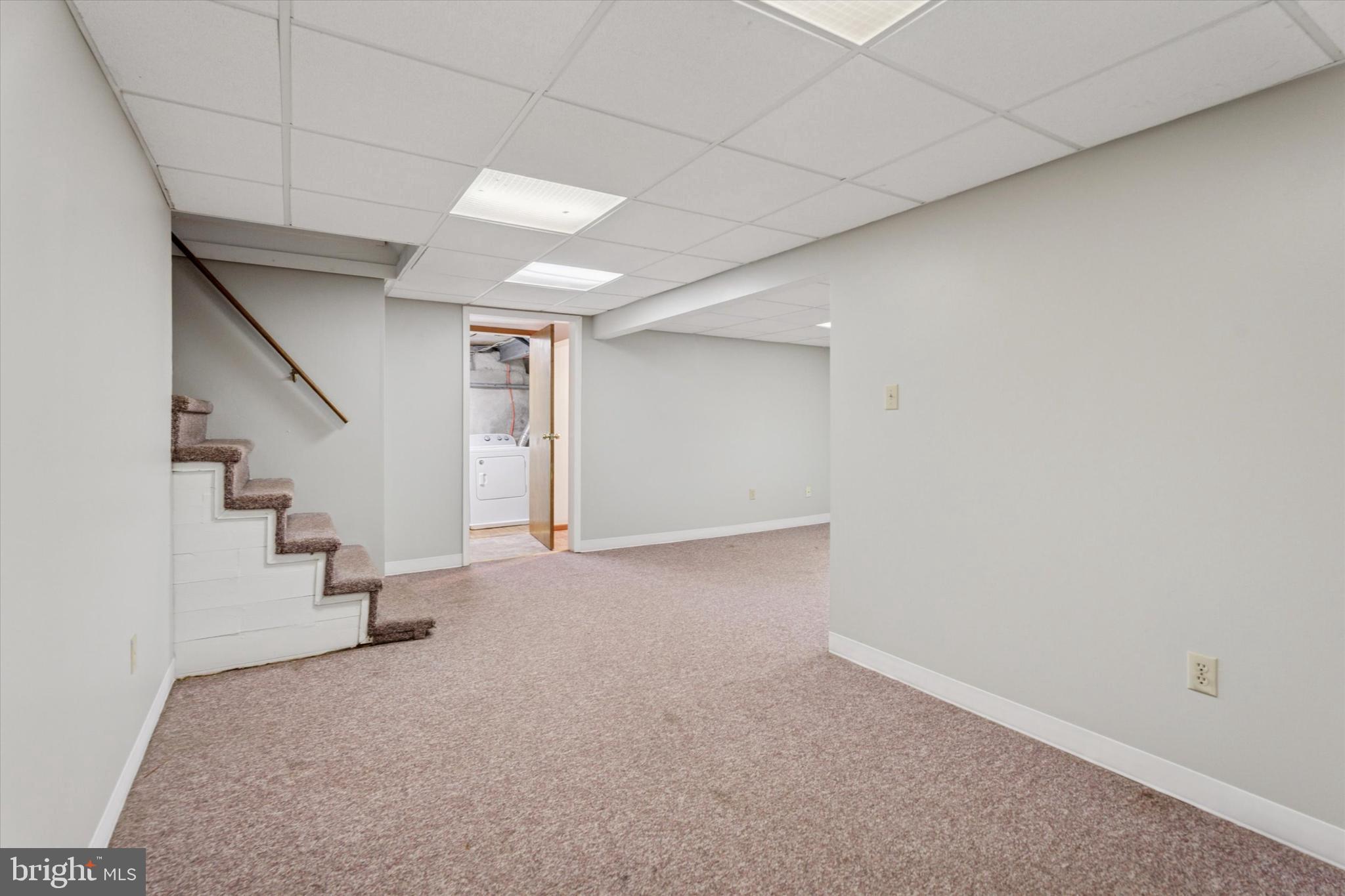 1442 Dorchester Road Havertown, PA 19083 - Photo 33 of 45 an empty room with staircase and white walls