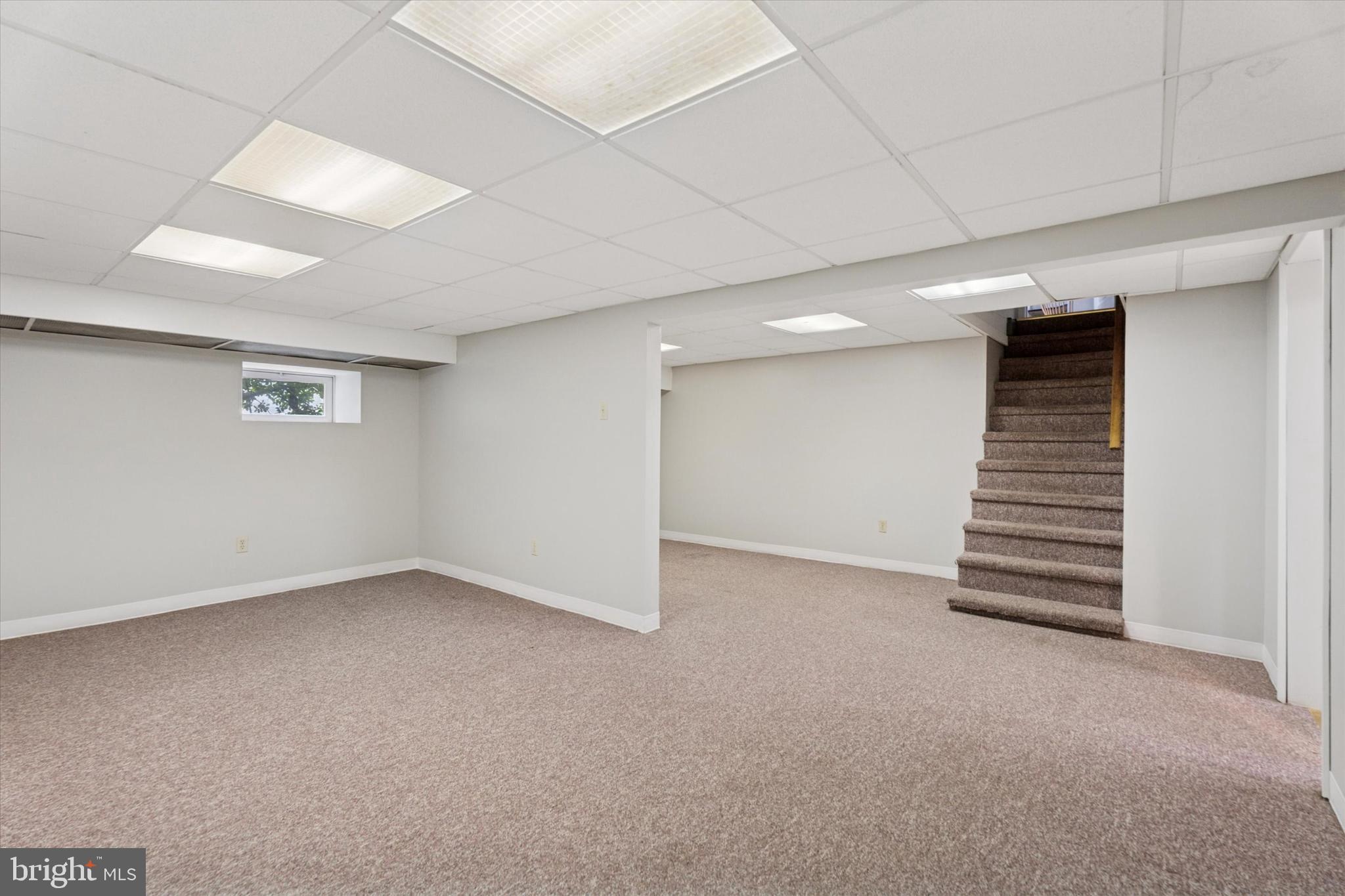 1442 Dorchester Road Havertown, PA 19083 - Photo 35 of 45 an empty room with a hallway and stairs