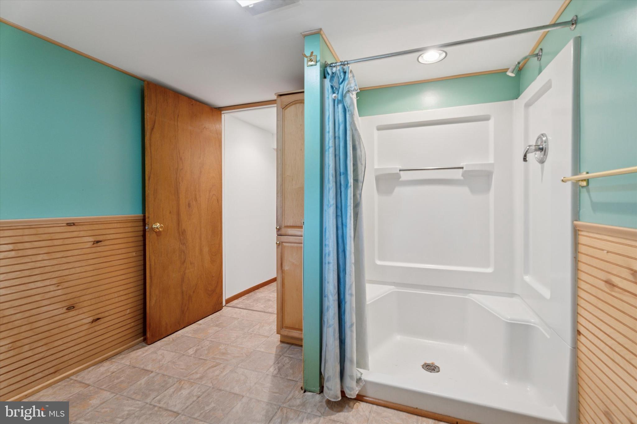 1442 Dorchester Road Havertown, PA 19083 - Photo 37 of 45 a bathroom with a glass shower door