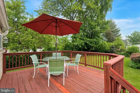 a view of a wooden deck and a yard