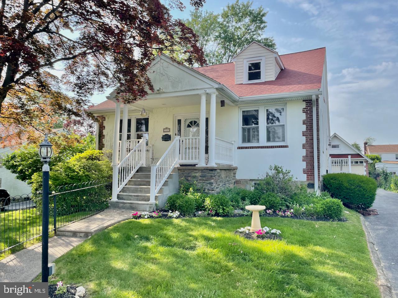 1442 Dorchester Road Havertown, PA 19083 - Photo 45 of 45 a front view of a house with a yard