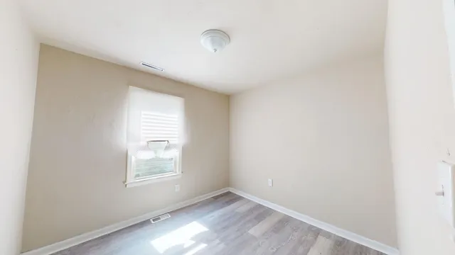 an empty room with windows