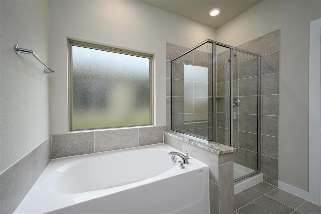 412 Heritage Grove Road Blue Ridge, TX 75424 - Photo 12 of 20 a bathroom with a bathtub and a shower