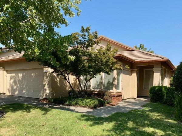 1160 Cobblefields Court Folsom, CA 95630 - Photo 1 of 26 a view of a white house with a yard and plants