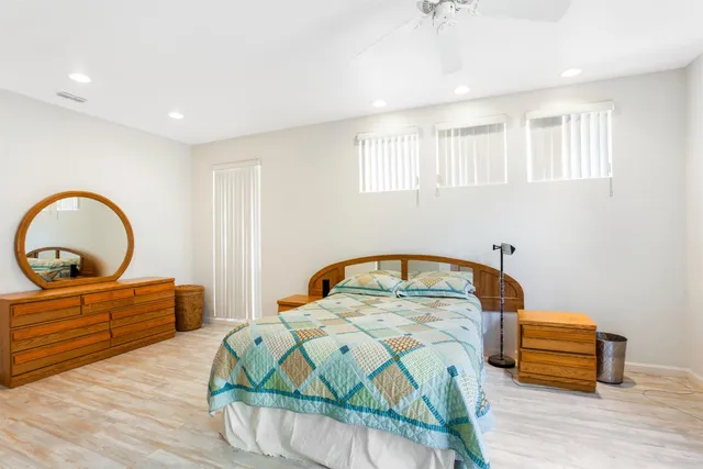 a bedroom with a bed and a dresser