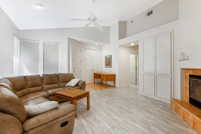 a living room with furniture and a fireplace