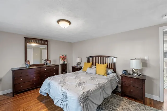 a bedroom with a bed and a dresser