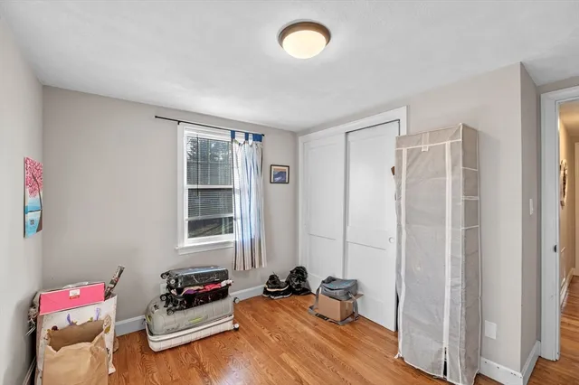 a bedroom with furniture and a window