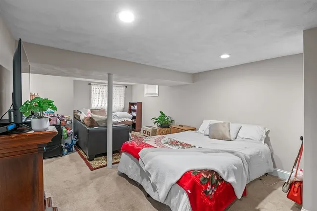 a bed room with furniture and a flat screen tv