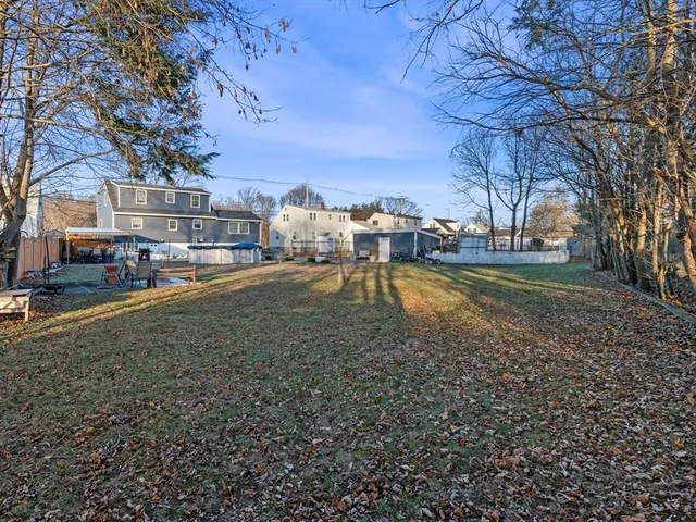 a view of a yard with table and chairs