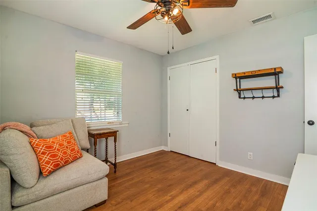 a bedroom with furniture and a window