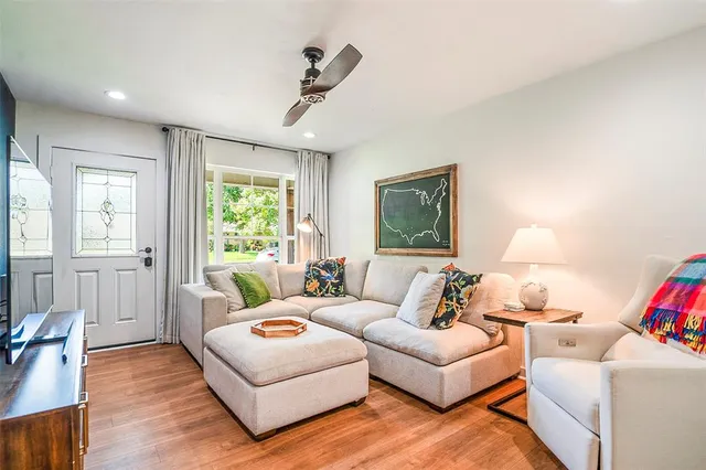 a living room with furniture and a window
