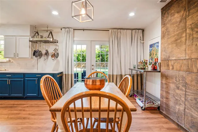 a view of a dining room with furniture and window