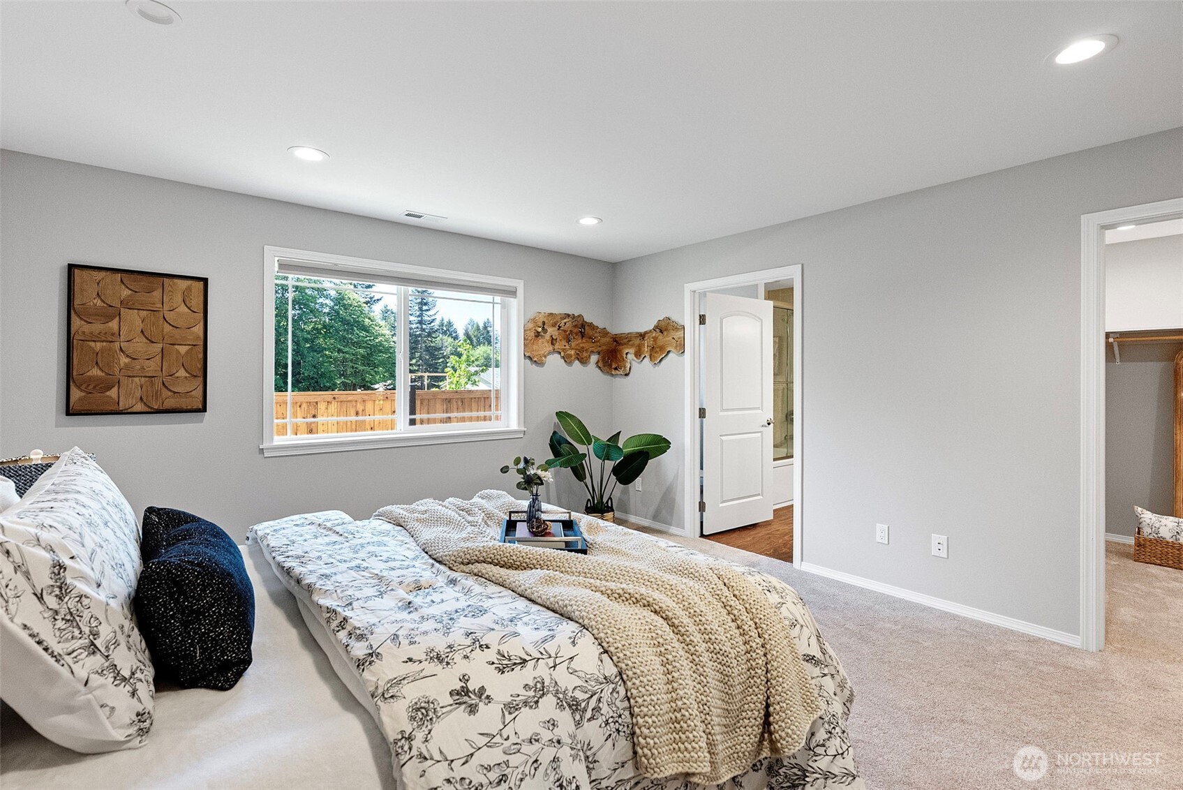40 Northeast Eagle Crest Place Belfair, WA 98528 - Photo 13 of 27 a bedroom with a bed and wooden floor