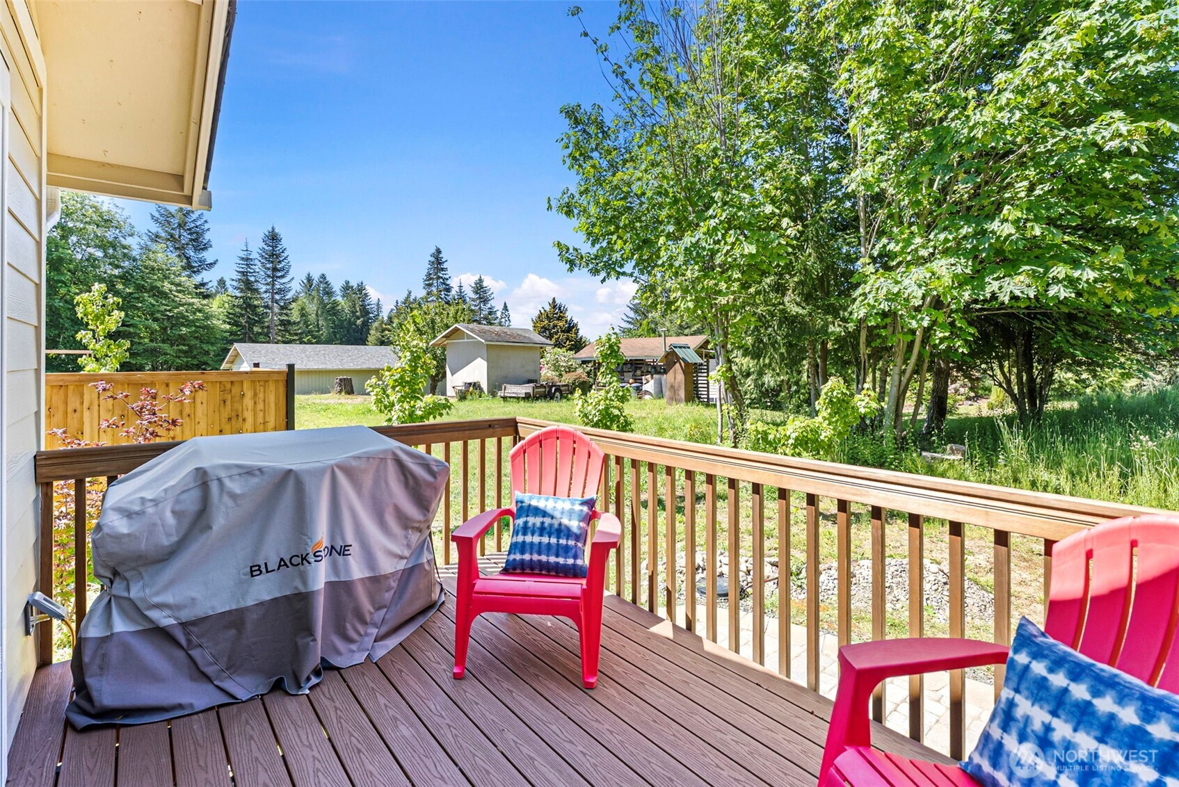 40 Northeast Eagle Crest Place Belfair, WA 98528 - Photo 21 of 27 a view of balcony with wooden floor and outdoor seating