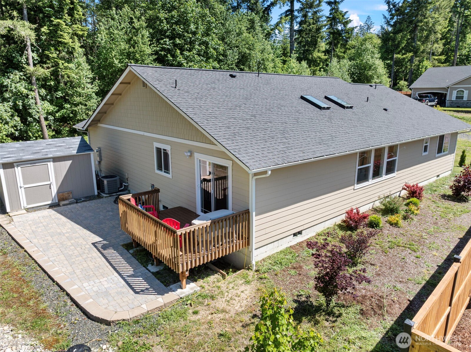 40 Northeast Eagle Crest Place Belfair, WA 98528 - Photo 22 of 27 a aerial view of a house with large trees and wooden fence