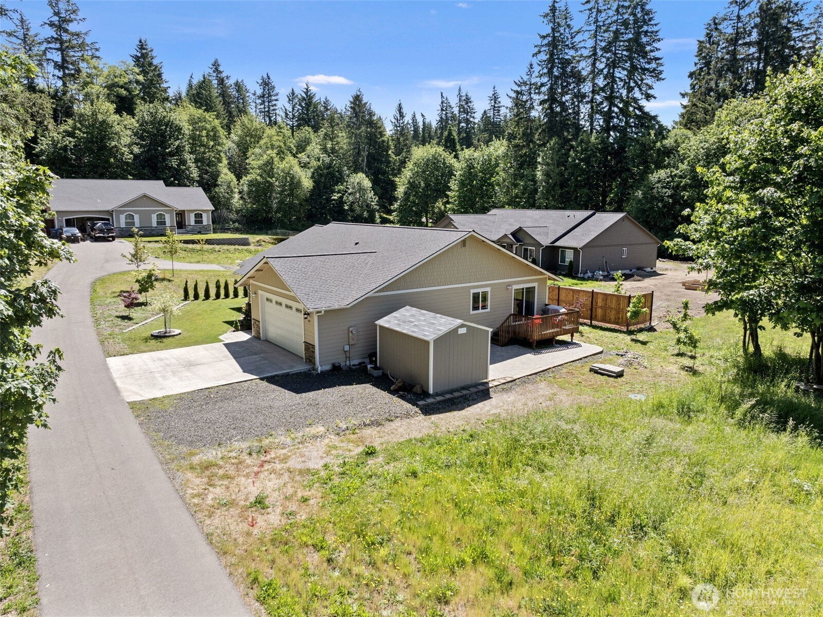 40 Northeast Eagle Crest Place Belfair, WA 98528 - Photo 26 of 27 a aerial view of a house with swimming pool and big yard