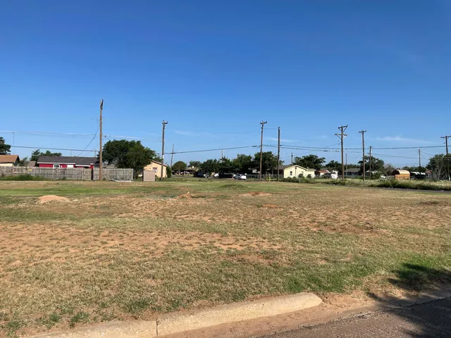 a view of a lake with boats and trees
